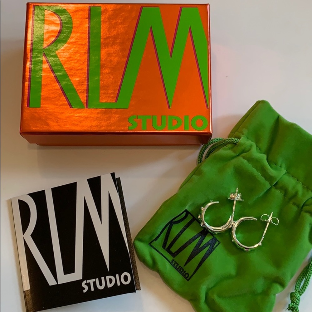 RARE Robert Lee Morris sterling hoop earring